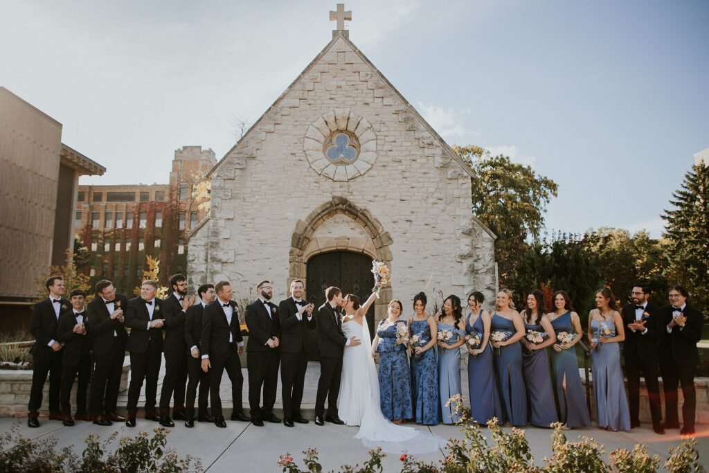 A wedding party in front of the historic Saint Joan of Arc Chapel in Milwaukee WI